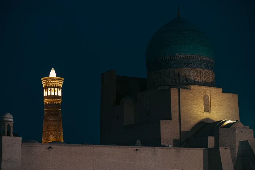 The Kalyan Minaret and Mir-i-Arab dome lit at night