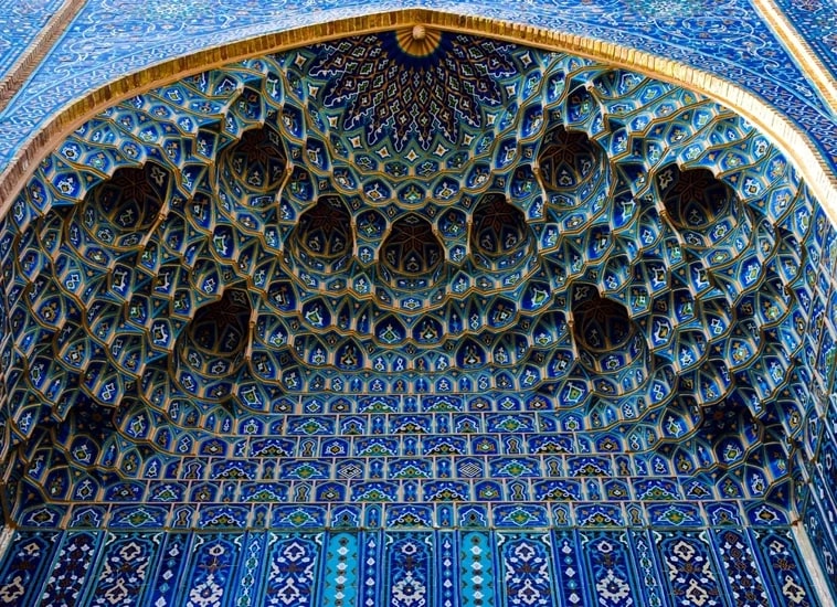 Close-up of gilded muqarnas ceiling tilework